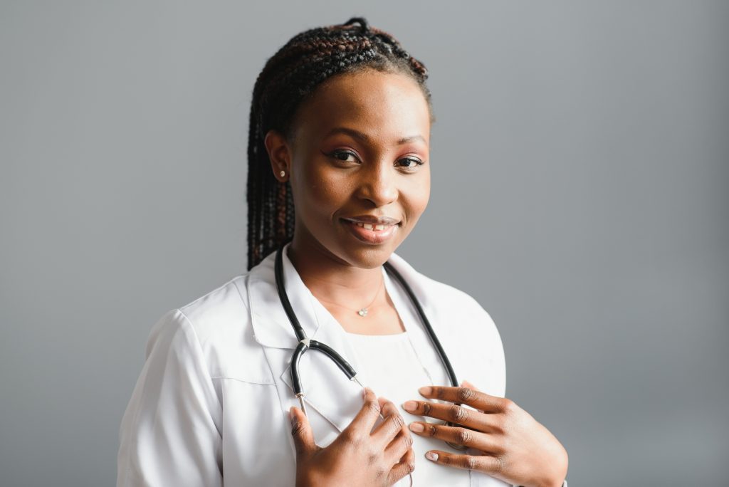 Portrait confident African female doctor medical professional